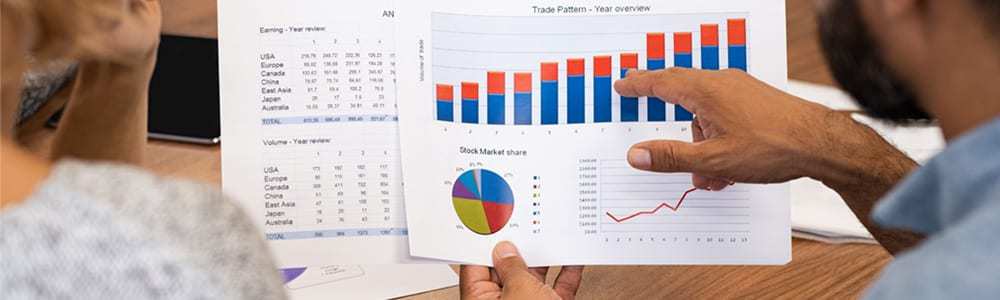 business-people-analyzing-graphs-YBKDRCN