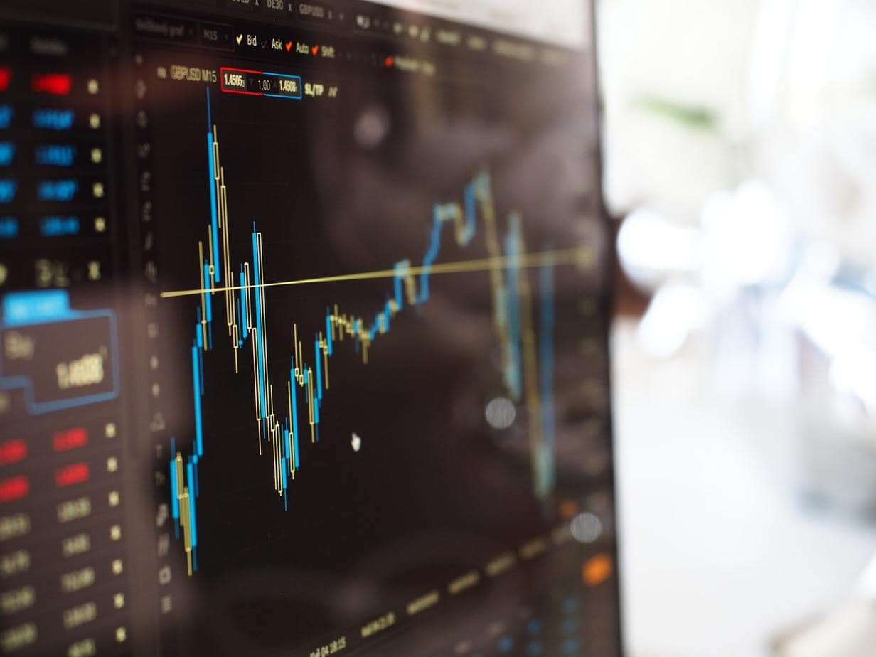 blue-and-yellow-graph-on-stock-market-monitor-159888