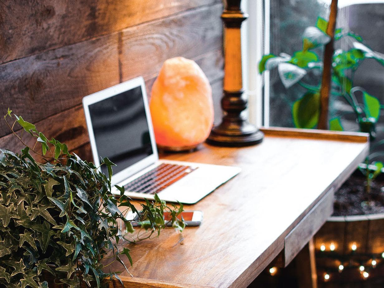 himalayan-salt-lamp-near-laptop-on-wooden-table-3653849 (1)